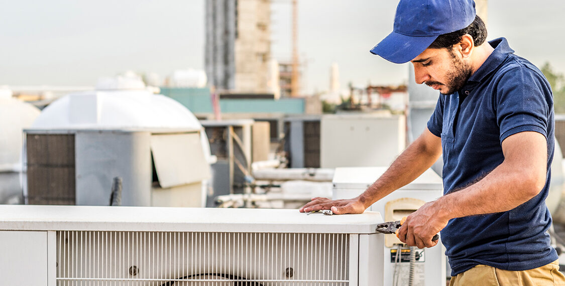 Man working on an HVAC unit