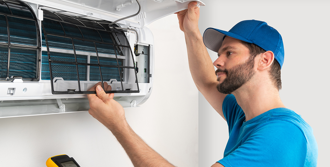 Man working on an AC unit