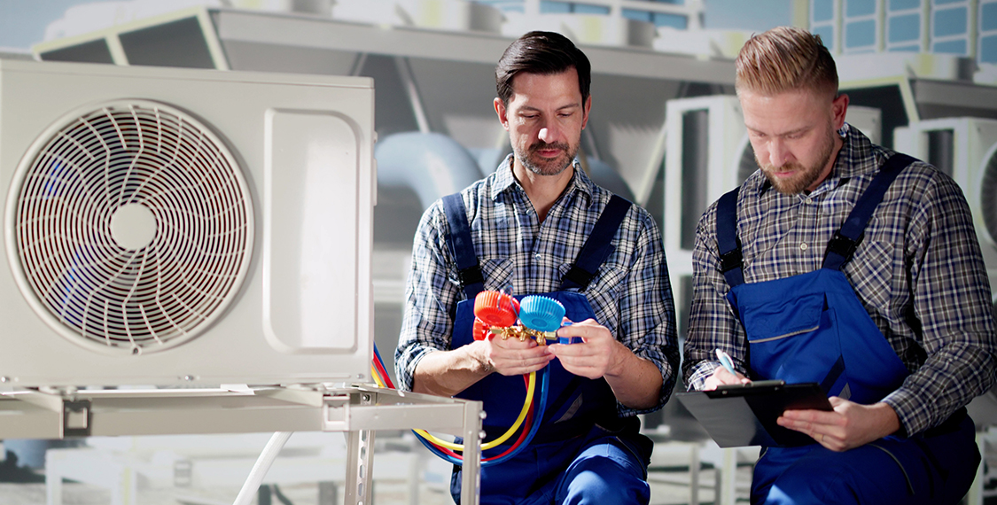 Two men testing an HVAC system