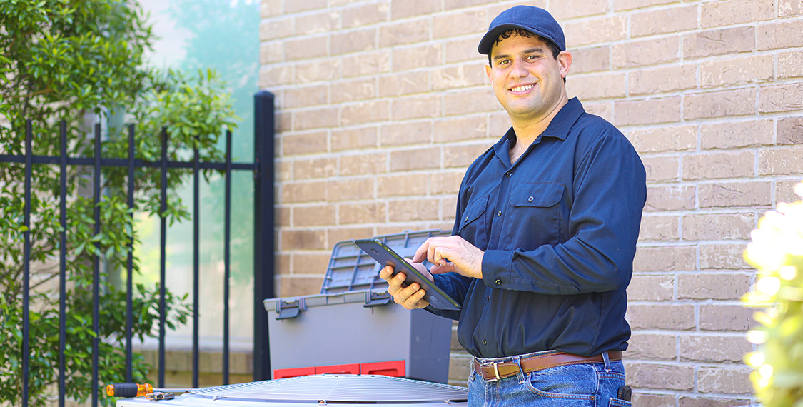 Man working with an HVAC system
