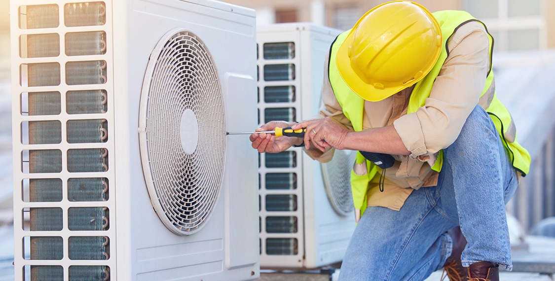 Man repairing an HVAC unit