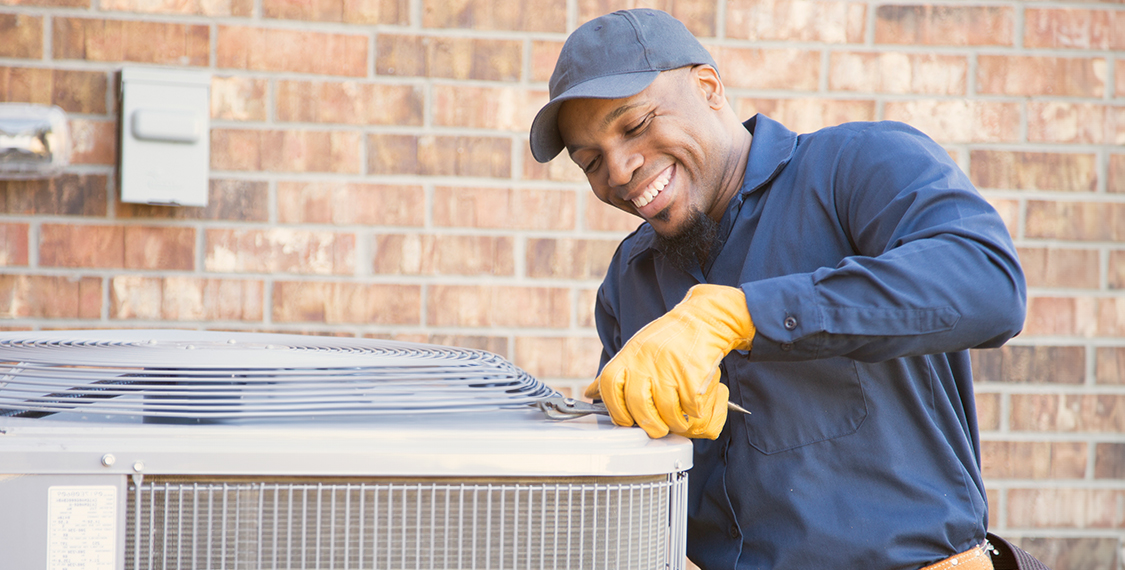 Man repairing an HVAC unit